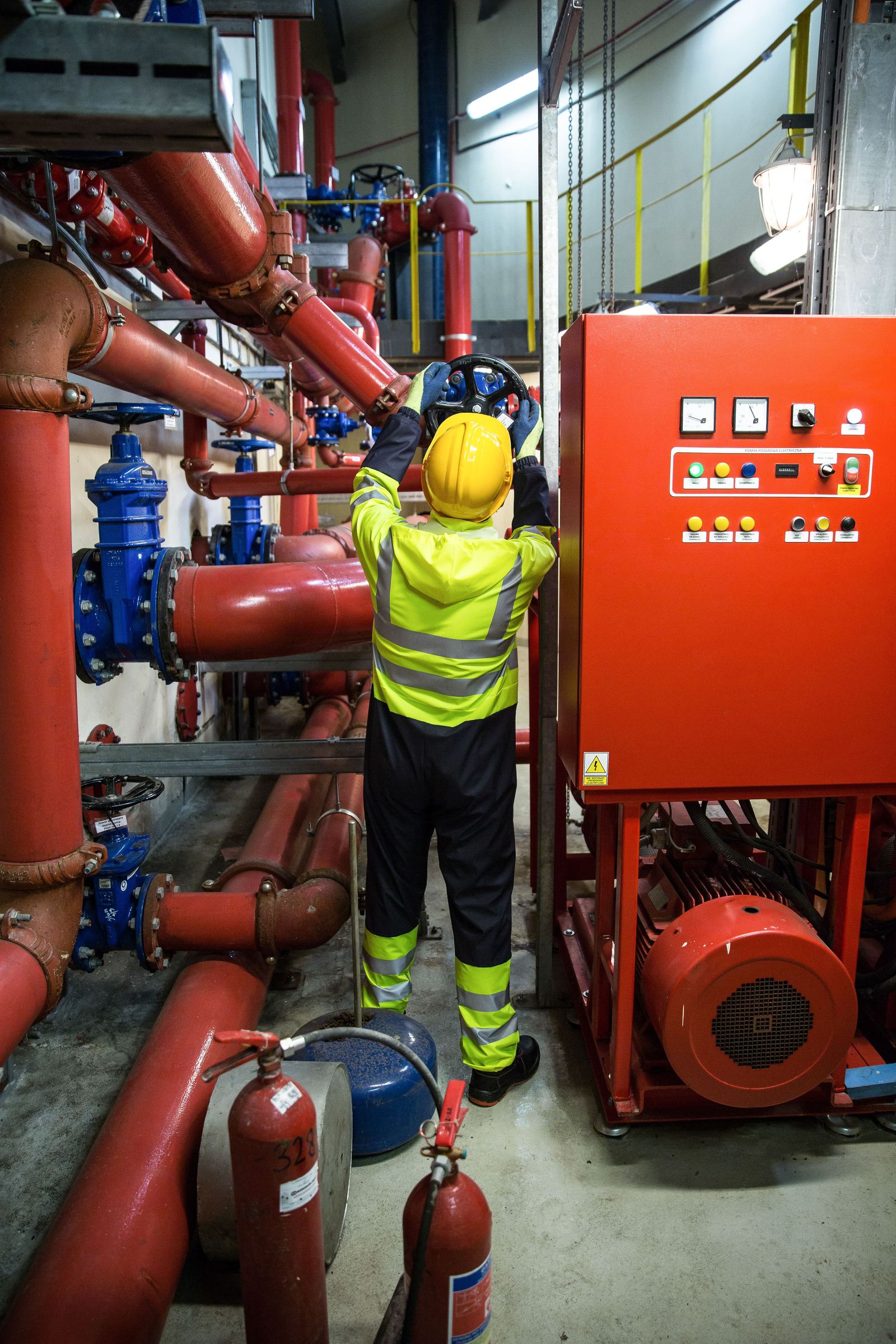 Engineer completing checks in a plant room