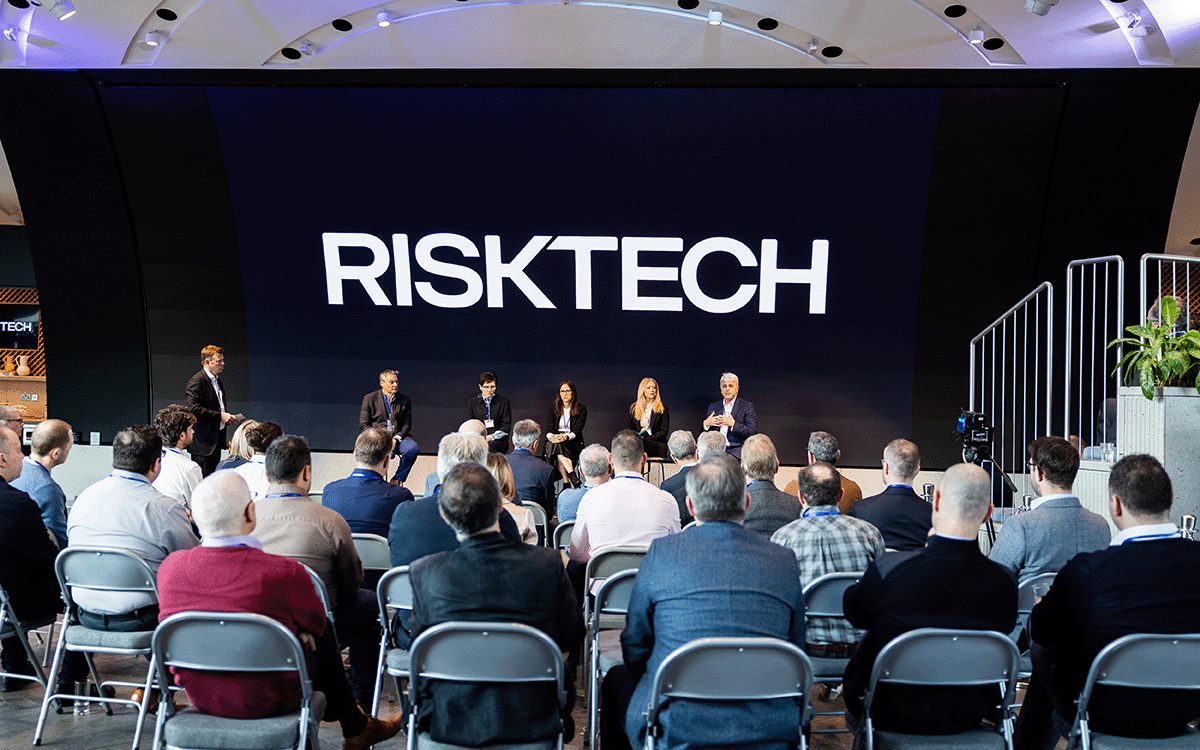 The RiskTech team on stage at a company event